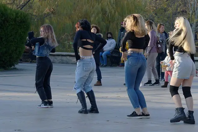 Women exercising together in a sunny park